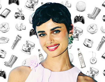 Supermodel Taylor Hill with short hair, light pink top and earrings sharing her favorites with The Strategist